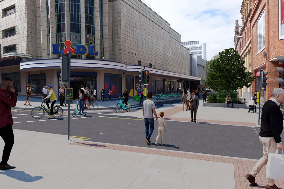 A graphic showing people crossing Union Street at traffic lights alongside a crossing for bikes and e-scooters, with a separated cycle path and e-scooter and e-bike parking on Broadmead