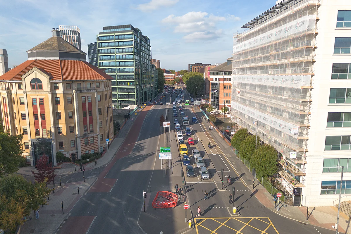 Temple Way Three lane traffic on both sides of Temple Way with large office blocks either side.